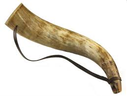 A drinking horn with a leather strap
