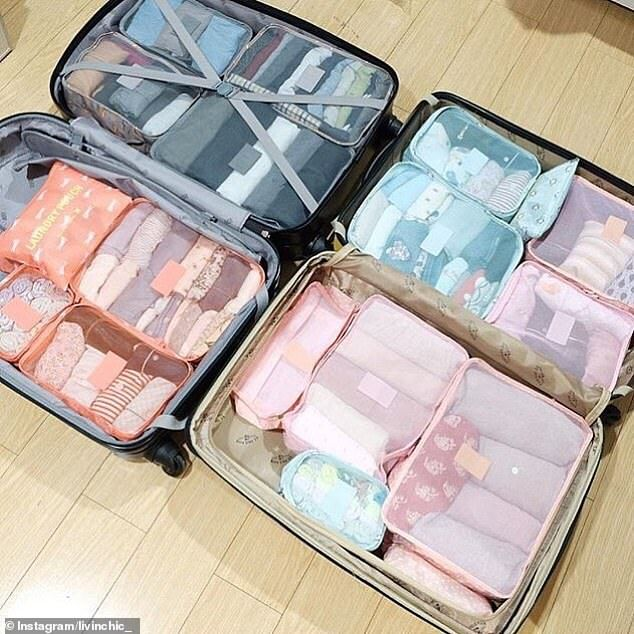 Two suitcases packed with colour-coordinated packing cubes, each garment grouped into its own compartment